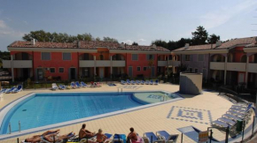 Holiday village escape with garden and fireplace Bibione